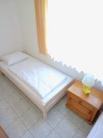 Łóżko lub łóżka w pokoju w obiekcie Flauta Apartamenty Rodzinne