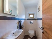 a bathroom with a sink and a toilet at Appartement Waldmoos in Ellmau