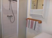 a bathroom with a towel rack and a mirror at résidence Etoile de mer in Saint-Pair-sur-Mer