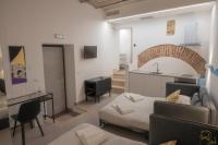 A bed or beds in a room at ALLA QUERCIA - CENTRO STORICO