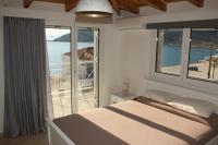 A bed or beds in a room at Asteri Apartments Mytikas 2-Bedroom Penthouse 360 Views