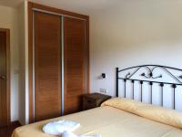 Postel nebo postele na pokoji v ubytování Apartamentos aDoniña Playa Major Sanxenxo