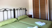 Postel nebo postele na pokoji v ubytování Apartamentos aDoniña Playa Major Sanxenxo