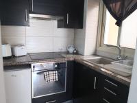Kuchyň nebo kuchyňský kout v ubytování Seashell Apartments