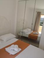 Postel nebo postele na pokoji v ubytování Seashell Apartments