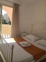 Postel nebo postele na pokoji v ubytování Seashell Apartments