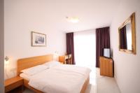 Łóżko lub łóżka w pokoju w obiekcie Depadansa Hotel Lucija***