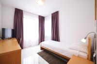 Łóżko lub łóżka w pokoju w obiekcie Depadansa Hotel Lucija***