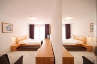 Łóżko lub łóżka w pokoju w obiekcie Depadansa Hotel Lucija***