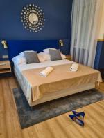 A bed or beds in a room at Ditlin Apartmanok