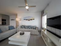 Televízia a/alebo spoločenská miestnosť v ubytovaní Apartamento Mirador de Torrox