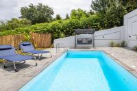 a swimming pool with two chairs and a table and a pool at Summer Stories Pool Villa in Potamós