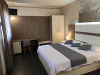 A bed or beds in a room at Therra Lodge