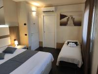 A bed or beds in a room at Therra Lodge