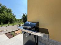 a barbecue grill with a bbqicultyicultyicultyicultyicultyicultyicultyiculty at VILLA BERTO in Nedeščina