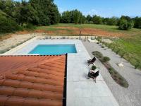 an overhead view of a swimming pool in a backyard at VILLA BERTO in Nedeščina