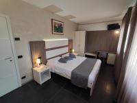 A bed or beds in a room at Therra Lodge