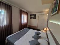 A bed or beds in a room at Therra Lodge