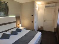 A bed or beds in a room at Therra Lodge