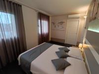 A bed or beds in a room at Therra Lodge