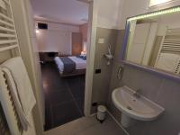 A bed or beds in a room at Therra Lodge