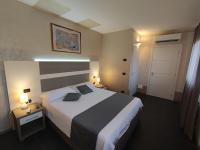 A bed or beds in a room at Therra Lodge