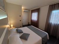 A bed or beds in a room at Therra Lodge