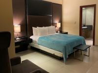Postel nebo postele na pokoji v ubytování Ramada by Wyndham Princess Santo Domingo