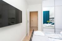 Łóżko lub łóżka w pokoju w obiekcie Apartament 54 Old Town
