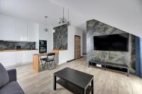 Televízia a/alebo spoločenská miestnosť v ubytovaní Lion Apartments - Botanica