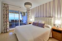 Posteľ alebo postele v izbe v ubytovaní Neptuno Malaga Apartamento de Lujo