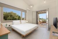 A bed or beds in a room at Ionian Garden Villas - Villa Sol