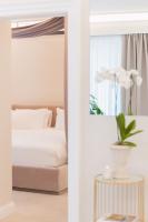 Posteľ alebo postele v izbe v ubytovaní Naxi Suites