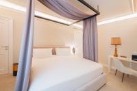 Posteľ alebo postele v izbe v ubytovaní Naxi Suites