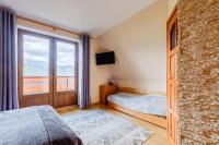 Posteľ alebo postele v izbe v ubytovaní Pokoje i apartament z widokiem na Tatry