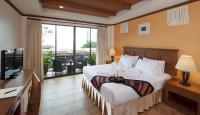 Ein Bett oder Betten in einem Zimmer der Unterkunft Sun Hill Hotel Patong