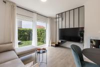 Televízia a/alebo spoločenská miestnosť v ubytovaní Apartment Dolce D