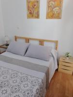 Postel nebo postele na pokoji v ubytování 1 Pasaje Fuente de Cantarero
