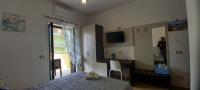 Televízia a/alebo spoločenská miestnosť v ubytovaní Bellavista Rooms