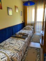 Łóżko lub łóżka w pokoju w obiekcie Buborék Apartman