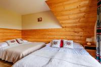 Posteľ alebo postele v izbe v ubytovaní Pokoje i apartament z widokiem na Tatry