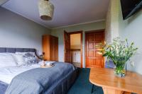 Posteľ alebo postele v izbe v ubytovaní Pokoje i apartament z widokiem na Tatry