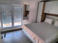 Posteľ alebo postele v izbe v ubytovaní Apartman Hanna