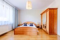 Posteľ alebo postele v izbe v ubytovaní Pokoje i apartament z widokiem na Tatry