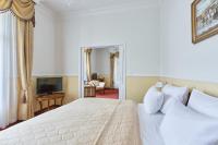 Postel nebo postele na pokoji v ubytování Spa Hotel Villa Ritter