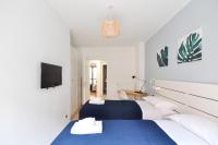 A bed or beds in a room at CaseOspitali - Casa Cri&Eli, super trilocale con terrazzo in zona Lambrate per 5