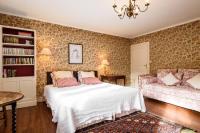 Łóżko lub łóżka w pokoju w obiekcie Maison Dominxenea