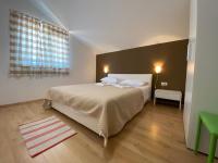 Postel nebo postele na pokoji v ubytování Apartments A&A