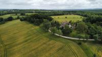 an aerial view of a house in a field at La maison du pech in Monteils
