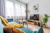 Televízia a/alebo spoločenská miestnosť v ubytovaní Uroczy apartament 2 pokoje - 10 min do morza!
